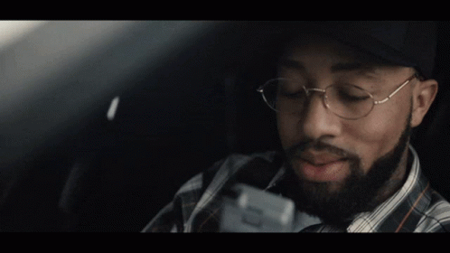 A Man Wearing A San Francisco Hat And Glasses GIF