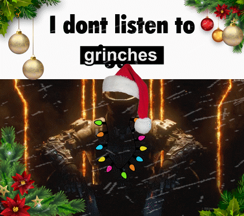 A Man Wearing A Santa Hat Is Surrounded By Christmas Decorations And Says " I Dont Listen To Grinches " GIF