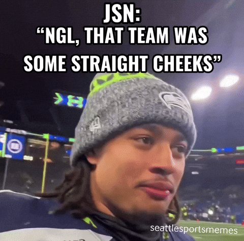 a man wearing a seattle seahawks hat and a jsn meme