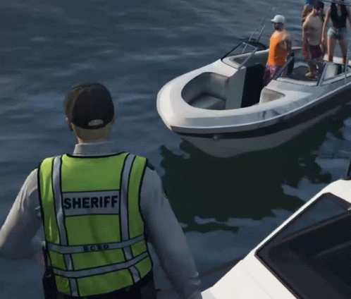 A Man Wearing A Sheriff Vest Is Standing Next To A Boat GIF