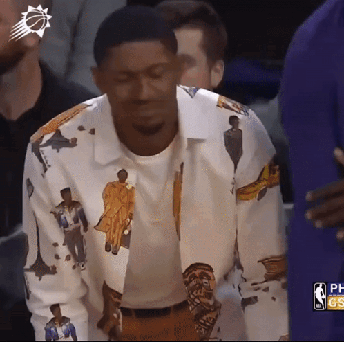 A Man Wearing A Shirt That Has A Picture Of A Man On It GIF