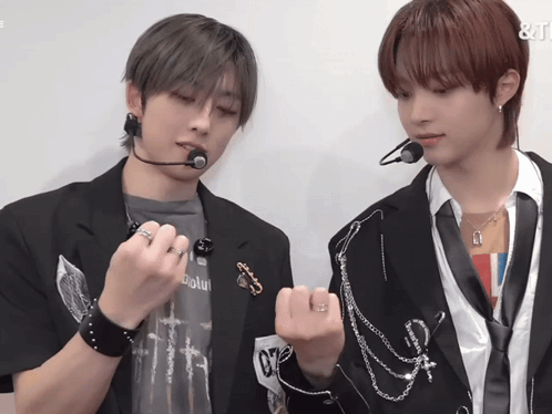 A Man Wearing A Shirt That Says ' Absolute ' On It Is Standing Next To Another Man GIF