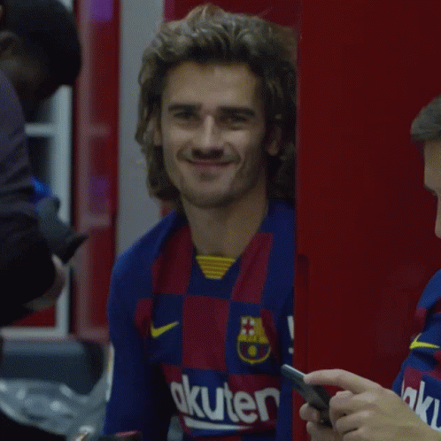 A Man Wearing A Shirt That Says Akuter On It Smiles GIF