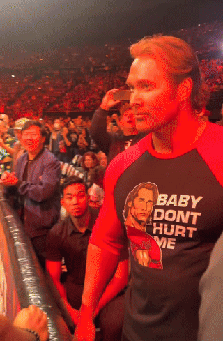 a man wearing a shirt that says " bad do n't hurt me "