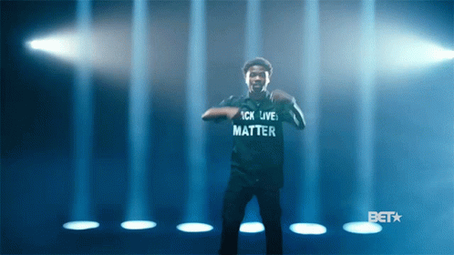 A Man Wearing A Shirt That Says " Black Lives Matter " GIF