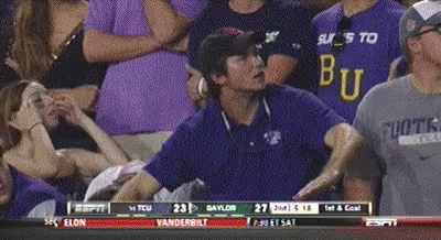 a man wearing a shirt that says ' bu ' on it