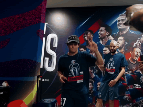 a man wearing a shirt that says ' champions ' on it