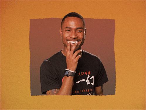 A Man Wearing A Shirt That Says Chigen On It Smiles GIF
