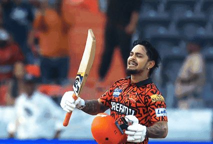 A Man Wearing A Shirt That Says Dream11 Holds Up A Bat GIF