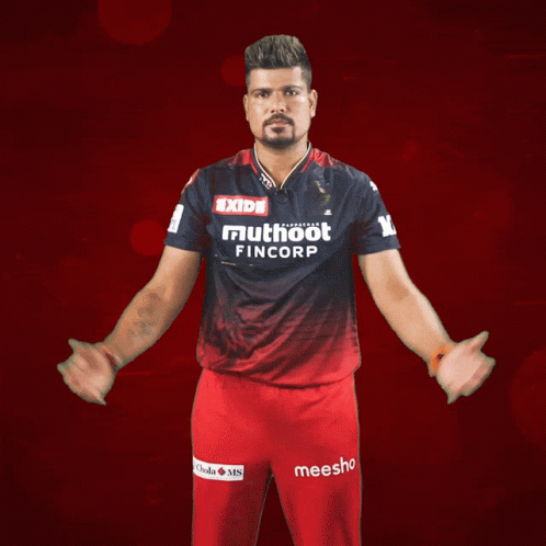 A Man Wearing A Shirt That Says Exide Mutuoot Fincorp GIF