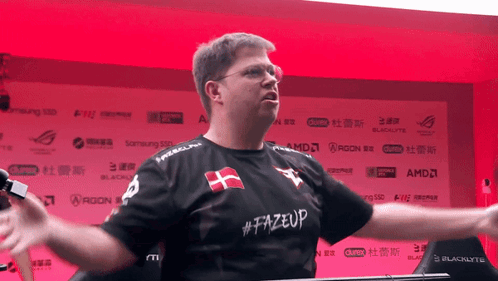 A Man Wearing A Shirt That Says # Fazeup GIF