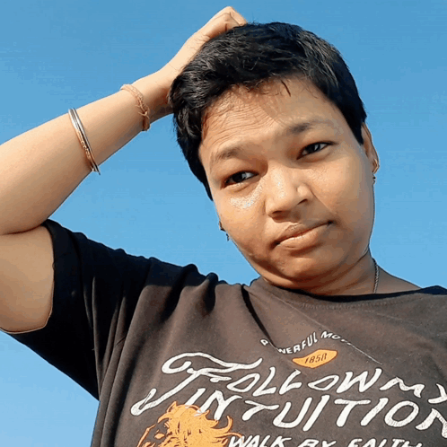 A Man Wearing A Shirt That Says Follow Your Intuition GIF