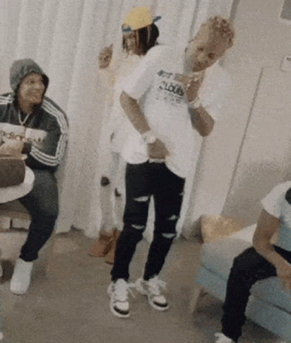 A Man Wearing A Shirt That Says Get Loud Is Dancing In A Room GIF