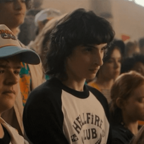A Man Wearing A Shirt That Says Hellfire Club On It GIF