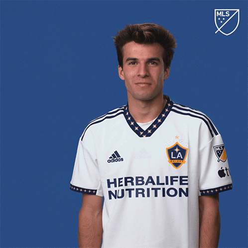 A Man Wearing A Shirt That Says Herbalife Nutrition On It GIF