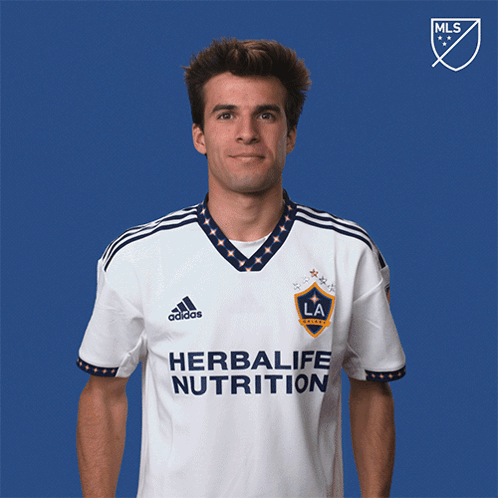A Man Wearing A Shirt That Says Herbalife Nutrition On It GIF