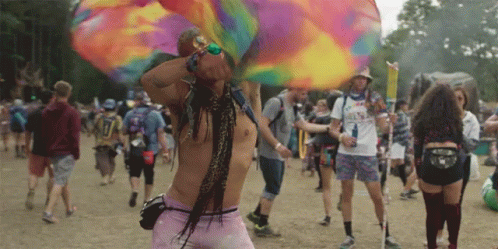 A Man Wearing A Shirt That Says ' I Love You ' On It Stands In A Crowd Of People GIF