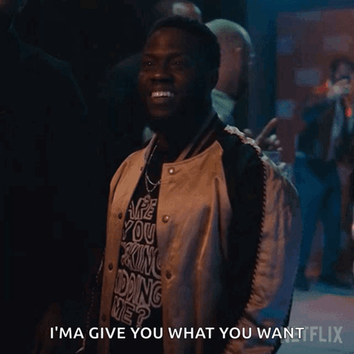 a man wearing a shirt that says i 'm ma give you what you want on it