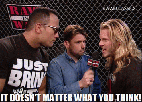 A Man Wearing A Shirt That Says Just Brin Is Talking To Two Other Men GIF