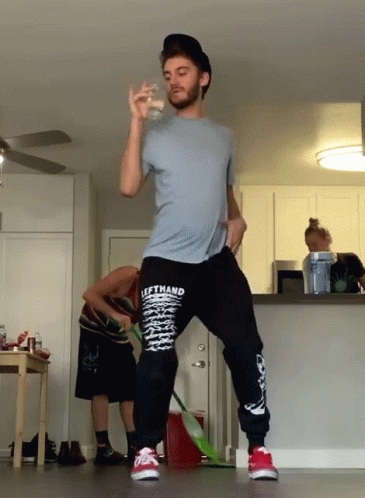 A Man Wearing A Shirt That Says Lefthand Is Standing In A Kitchen GIF
