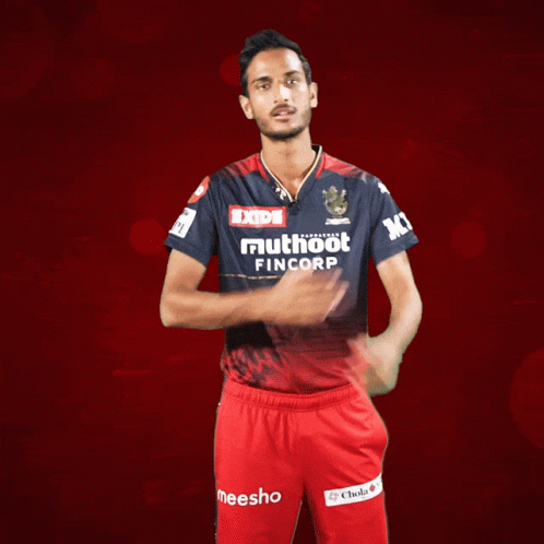 a man wearing a shirt that says muthoot fincorp on it
