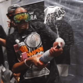 A Man Wearing A Shirt That Says Nba Champions On It GIF