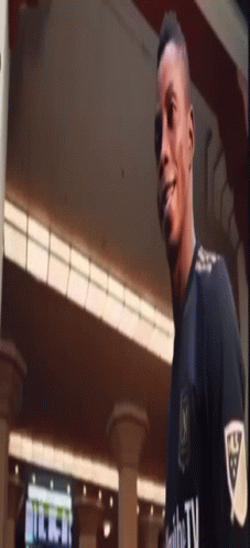 A Man Wearing A Shirt That Says ' Nc ' On It GIF