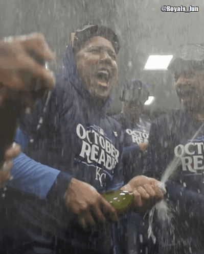 A Man Wearing A Shirt That Says October Ready Is Holding A Bottle Of Champagne GIF