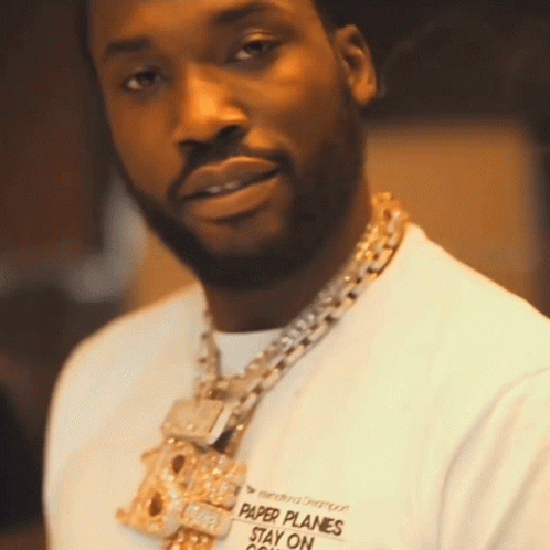 A Man Wearing A Shirt That Says " Paper Planes Stay On " GIF