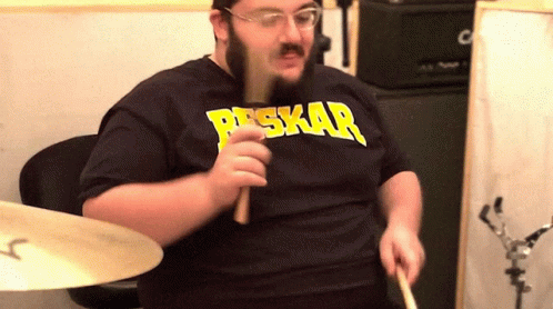 A Man Wearing A Shirt That Says Peskar On It GIF