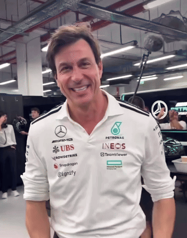A Man Wearing A Shirt That Says ' Petronas ' On It GIF
