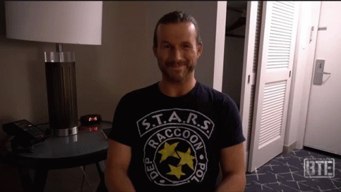 a man wearing a shirt that says s.t.a.r.s. raccoon police
