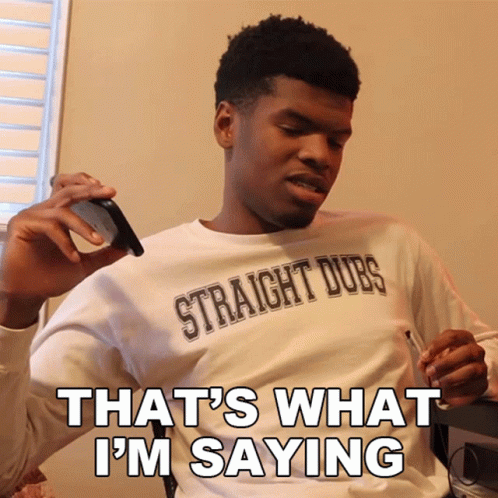 A Man Wearing A Shirt That Says Straight Dubs Is Smoking A Cigarette GIF