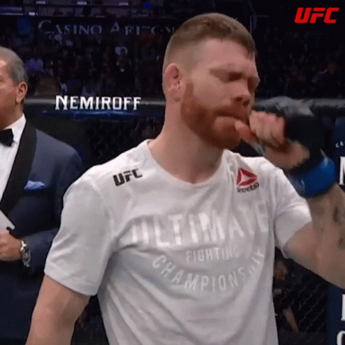A Man Wearing A Shirt That Says " Ultimate Fighting Champions " GIF