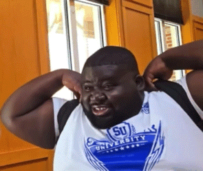A Man Wearing A Shirt That Says University On It GIF