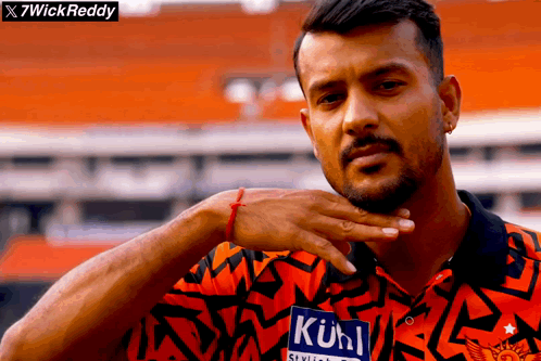 A Man Wearing A Shirt With A Label That Says " Kuhl " On It GIF