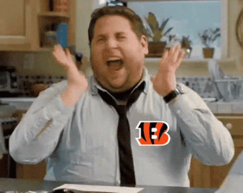 A Man Wearing A Shirt With The Letter B On It Is Screaming In A Kitchen . GIF