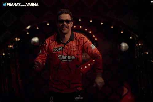 A Man Wearing A Shree Cement Shirt Is Dancing GIF