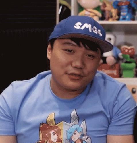 A Man Wearing A Smg4 Hat And A Blue Shirt GIF