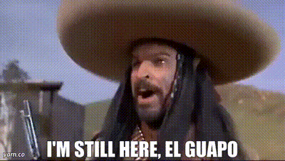 A Man Wearing A Sombrero And A Gun Is Saying `` I 'M Still Here , El Guapo '' . GIF