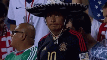 A Man Wearing A Sombrero And A Jersey With The Number 10 On It GIF