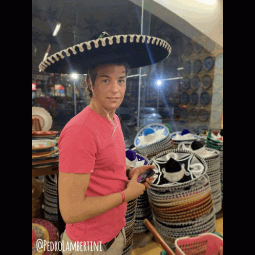 A Man Wearing A Sombrero And A Pink Shirt With @Pedrolambertini Written On It GIF