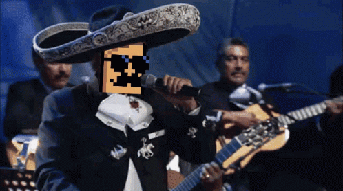 a man wearing a sombrero is singing into a microphone