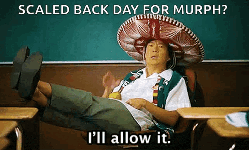 A Man Wearing A Sombrero Is Sitting In A Classroom With His Feet Up And The Words Scaled Back Day For Murph . GIF