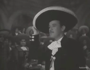 a man wearing a sombrero says que me maten de una vez in a black and white photo
