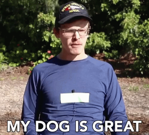 A Man Wearing A Space Shuttle Nasa Hat And Glasses Says My Dog Is Great GIF