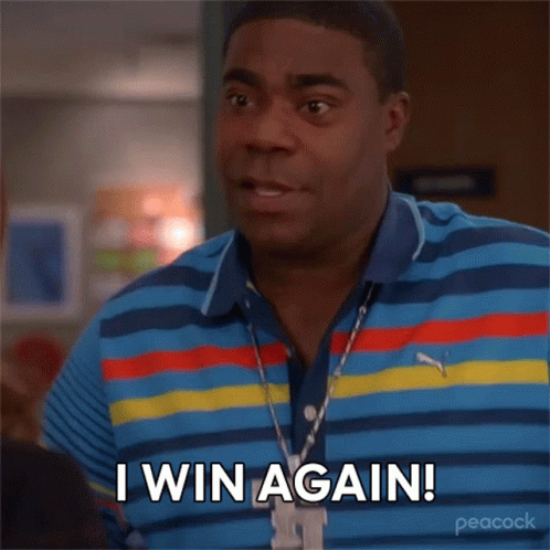 A Man Wearing A Striped Shirt And A Necklace Says I Win Again GIF