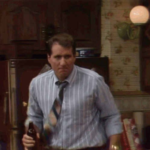 Man In Striped Shirt Holding Beer GIF