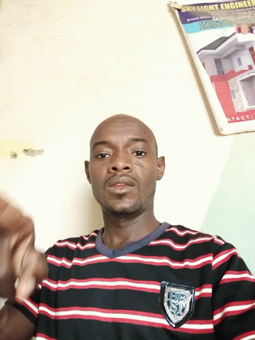 A Man Wearing A Striped Shirt Has A Patch On His Chest That Says ' Usc ' On It GIF