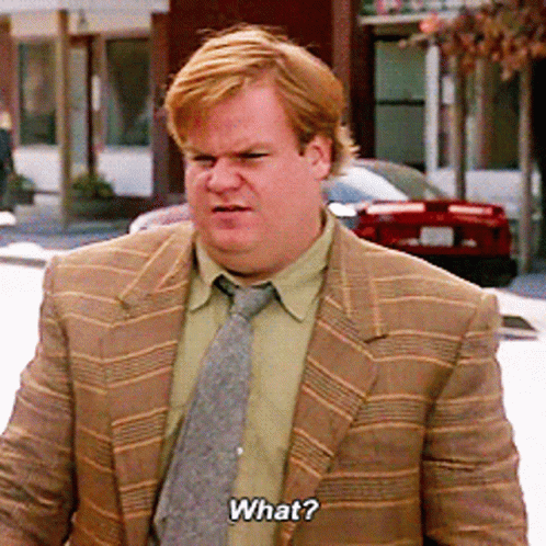 A Man Wearing A Suit And Tie Is Asking What GIF